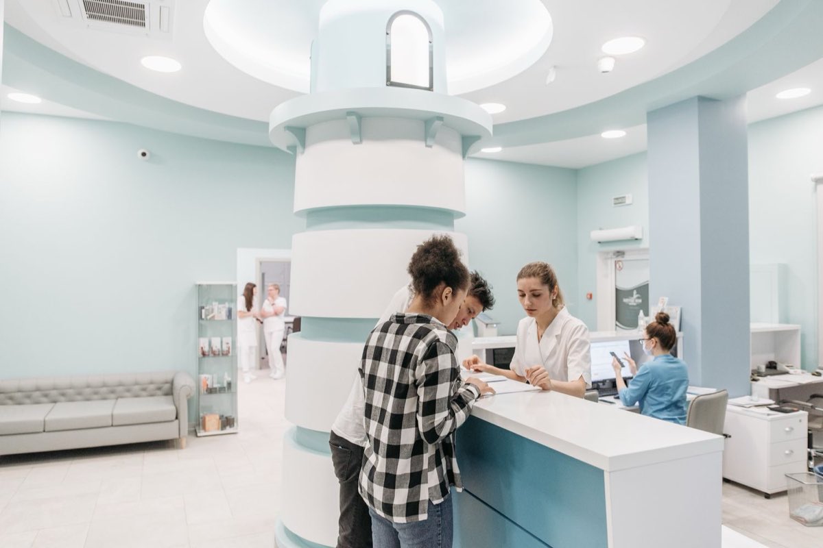 Patients at a clinic front desk