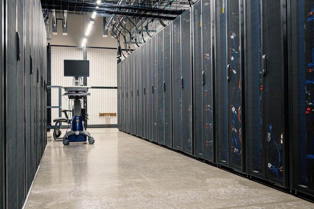Racks of servers in a data centre aisle